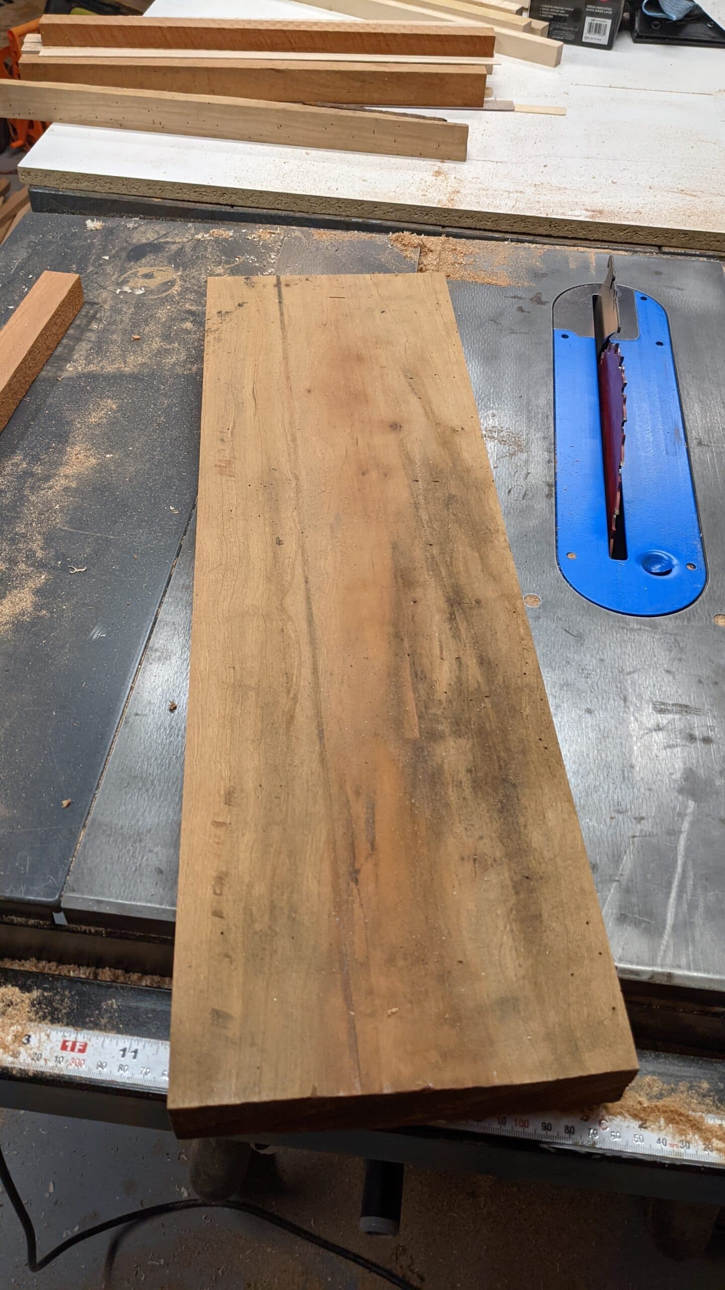 Koshur Chaan Woodworking 5 Hardwood plank on a table saw in the woodworking studio