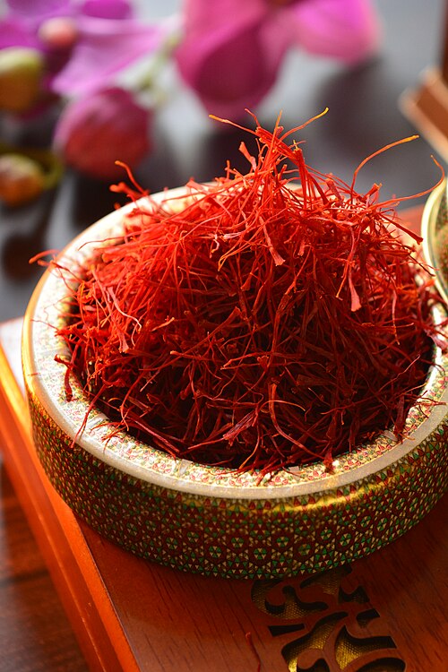 Red saffron threads in a decorative bowl